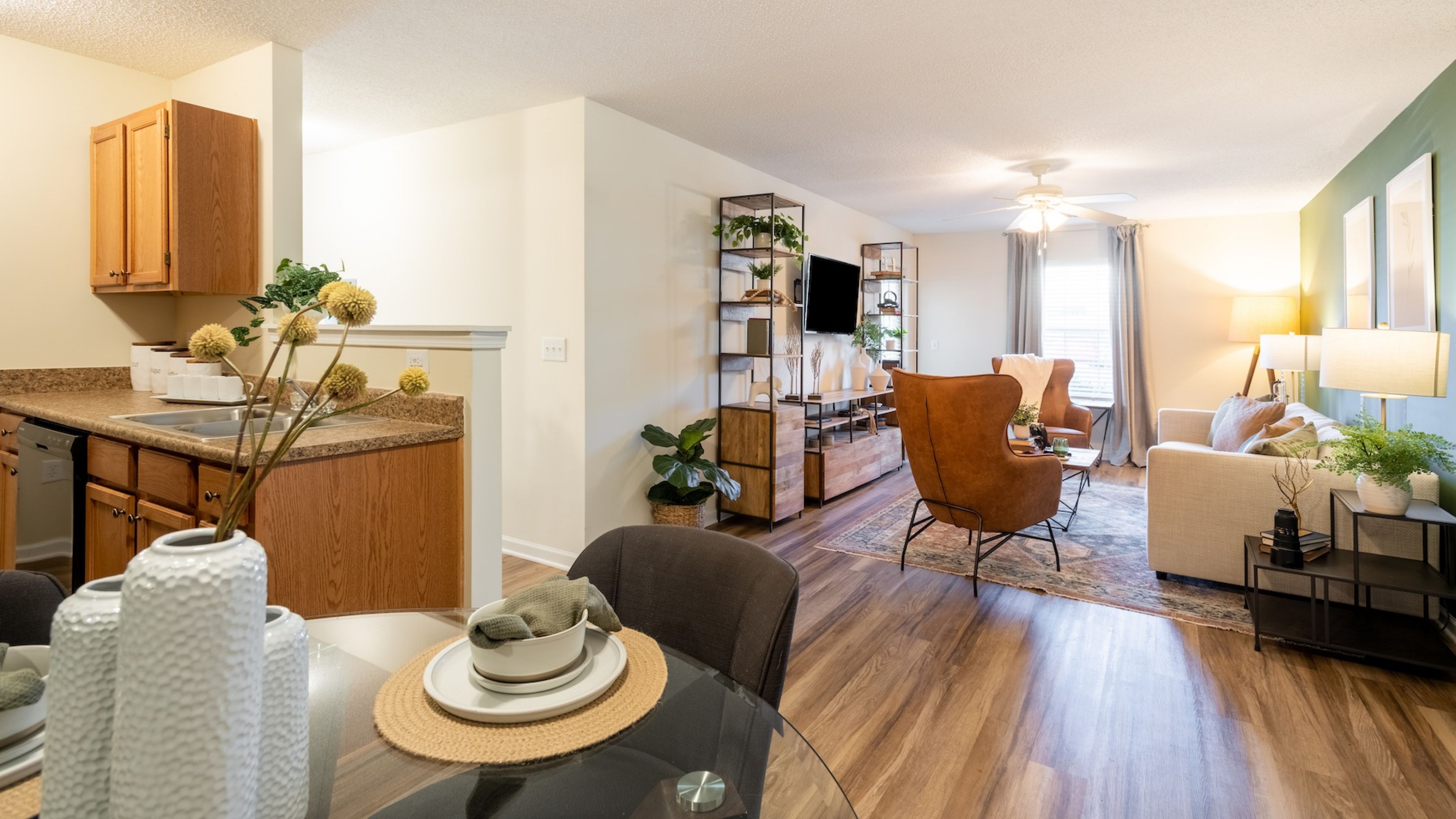 Hawthorne at the Hall apartment kitchen and living space with wood floors and large open plan living area