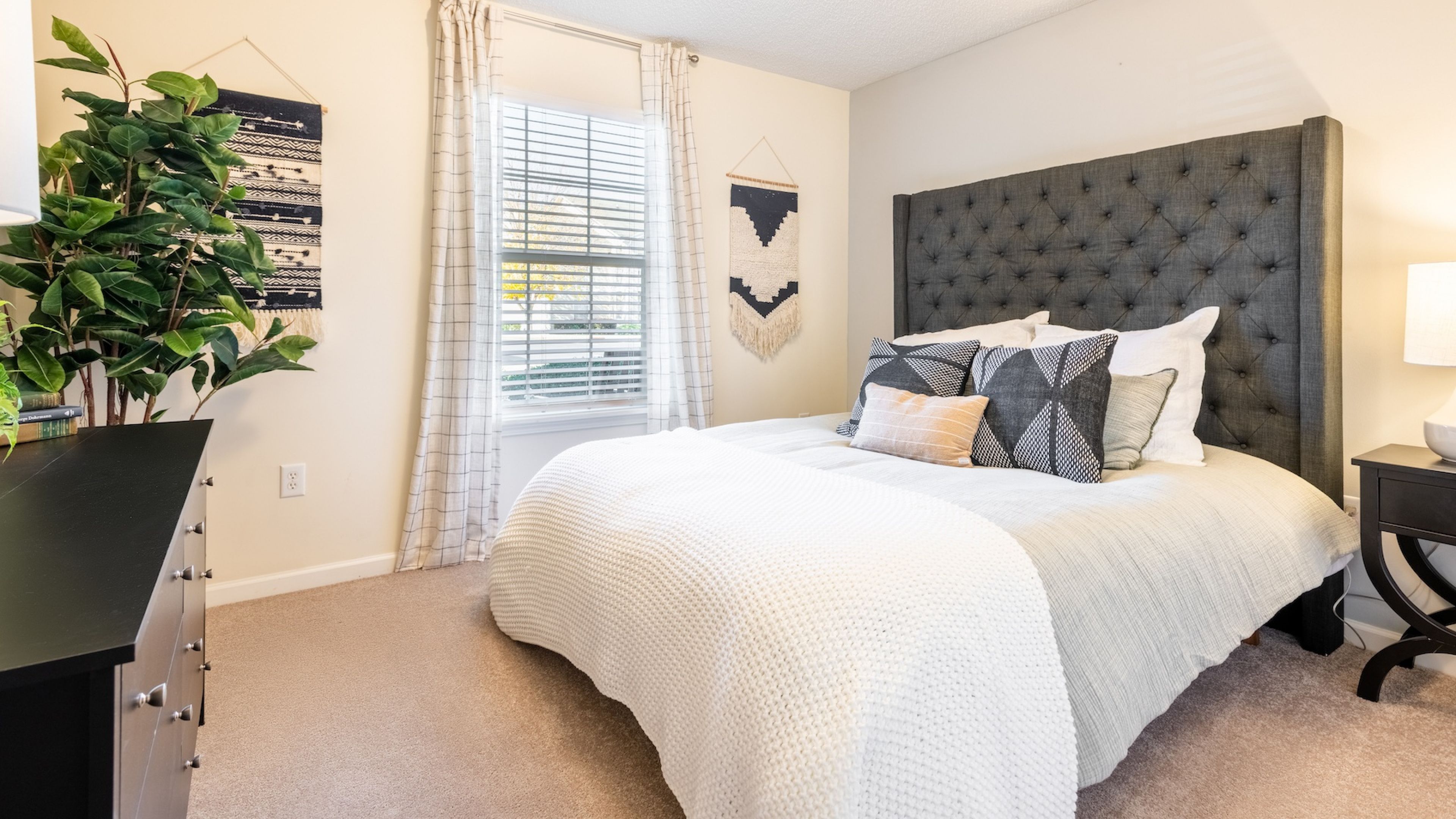 Hawthorne at the Hall spacious apartment bedroom with carpet and large windows